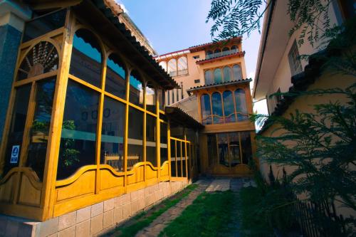 a building with a large window on the side of it at Centenario Inn in Cusco