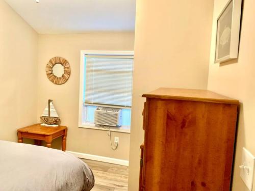 a bedroom with a bed and a window at The Lighthouse-3 Bedroom with Casino Pier Gameroom in Seaside Heights