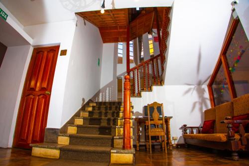 a stairway in a building with a stair case at Centenario Inn in Cusco