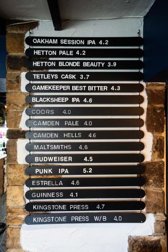 a sign on the side of a brick wall at Black Horse Hotel in Grassington