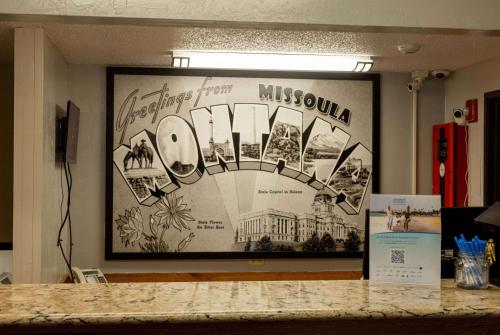 a large picture on the wall of a museum at Super 8 by Wyndham Missoula/Brooks Street in Missoula
