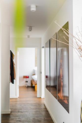 a living room with a wall of glass at Panorama Bliss - Luxus Apartment in Braunschweig's Altstadt in Braunschweig