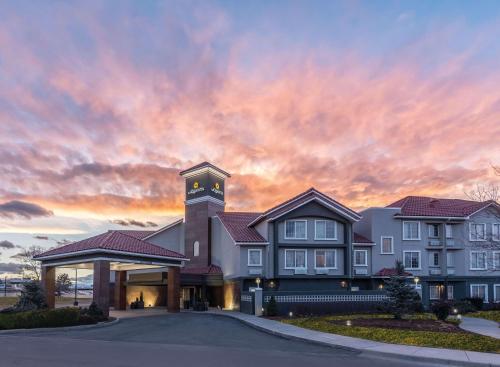 a building with a clock tower at sunset at La Quinta by Wyndham Denver Tech Center in Greenwood Village