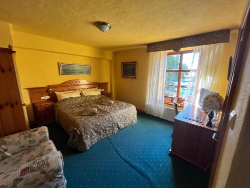 Ein Bett oder Betten in einem Zimmer der Unterkunft Gościniec Zamkowy