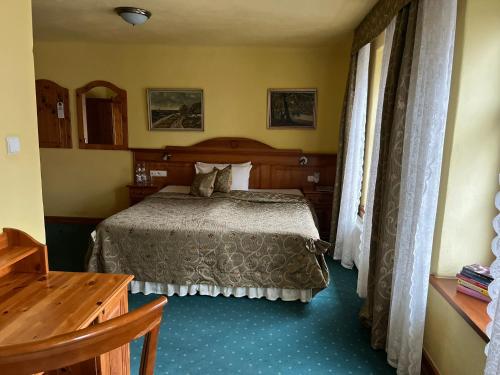 Ein Bett oder Betten in einem Zimmer der Unterkunft Gościniec Zamkowy