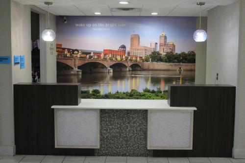 a large mural of a bridge on a wall in a building at La Quinta Inn & Suites by Wyndham Indianapolis Downtown in Indianapolis