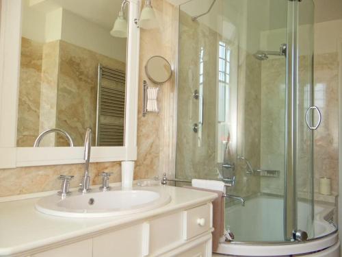 a bathroom with a sink and a shower at Pian dei Giullari Suite in Florence