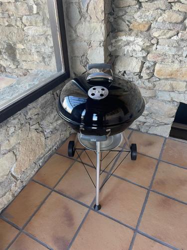 a black chair with a panda face on the seat at Mas Sabaters - L'Era de Sabaters in Tavernoles