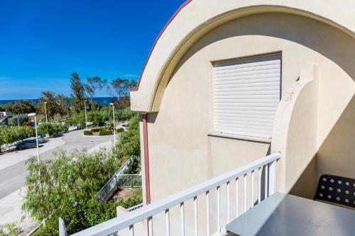 a balcony with a window with a view of a street at VastoMare - appartamento Vasto Marina in Vasto