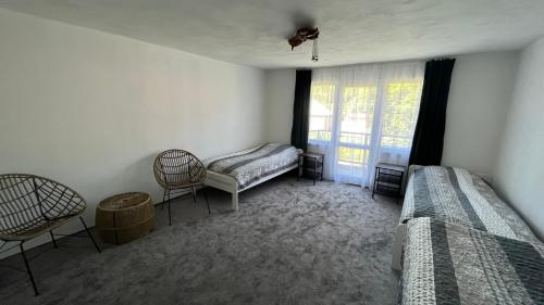 Postel nebo postele na pokoji v ubytování Apartmánový dom Adas