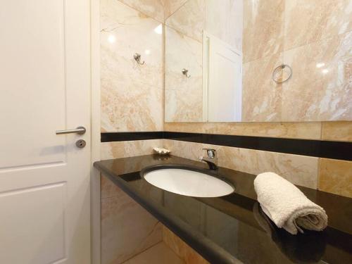 a bathroom with a sink and a mirror at Greek Aesthetic Manor House in Nea Makri