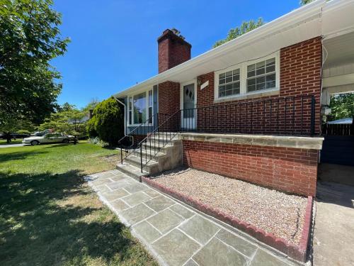 a brick house with a brick staircase in front of it at Spacious single family home close to VA and DC 5mins to MGM in Fort Washington