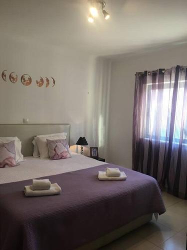 a bedroom with two beds with towels on them at 3 Bedroom apartment with pool in Lagos in Lagos