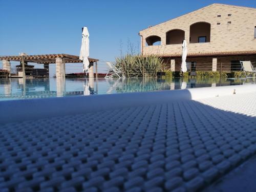 a view of a swimming pool in front of a building at B&B CasalFarano in Cupra Marittima
