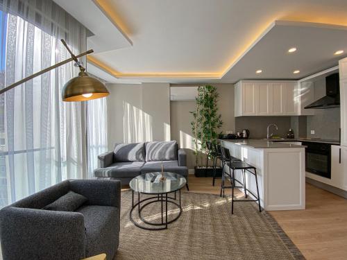 a living room with a couch and a table at Bolahenk Suites in Istanbul