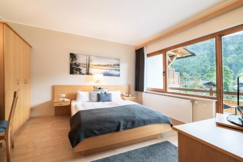 Postel nebo postele na pokoji v ubytování Hotel Trattnig