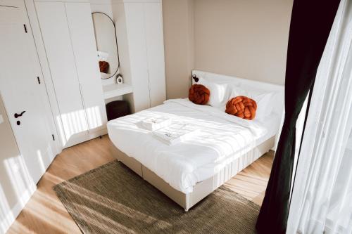 a small bedroom with a bed with pumpkins on it at Bolahenk Suites in Istanbul