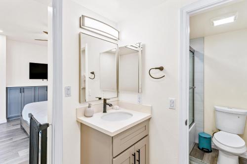a bathroom with a sink and a toilet at 4912 Seashore A Lower in Newport Beach