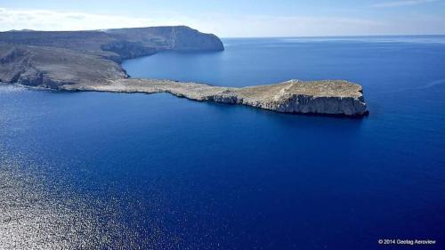 an island in the middle of a body of water at Elgina Apartments2 MANI in Mína