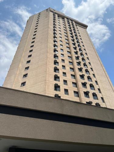 a tall building with balconies on the side of it at Flat maravilhoso em frente aeroporto de Congonhas Nobile in Sao Paulo