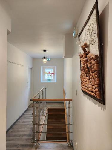 a staircase in a house with a stone wall at Appartement calme Le clos de Renée in Hautvillers