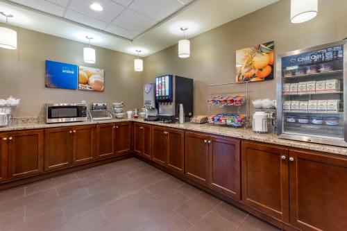 a lobby of a fast food restaurant with a counter at Comfort Suites Bridgeport - Clarksburg in Bridgeport