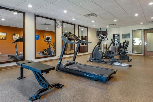 a gym with several treadmills and elliptical machines at Comfort Suites Bridgeport - Clarksburg in Bridgeport