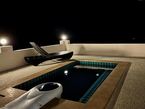 a swimming pool with a sink and a toilet at KohTao Studios Sunset in Koh Tao