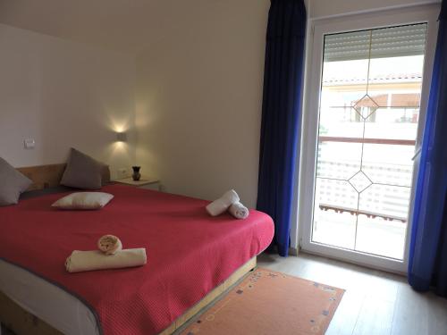 Postel nebo postele na pokoji v ubytování Apartman IV ( 2 + 2 )