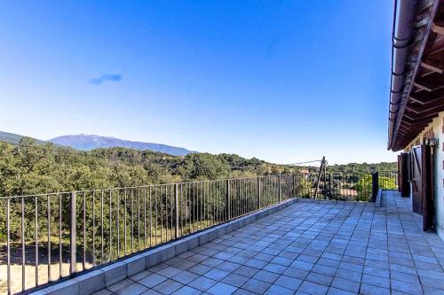 a balcony with a view of the mountains at Catalunya Casas Nature and Tranquility for 24 pax - 30km to beach in Sant Pere de Vilamajor