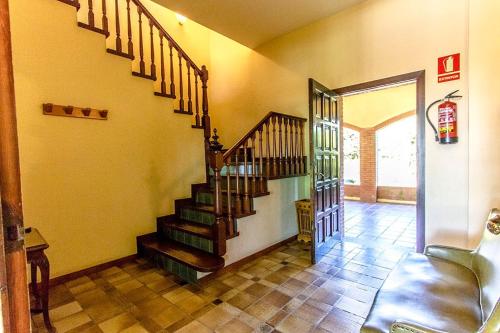 a hallway with a staircase in a house at Catalunya Casas Nature and Tranquility for 24 pax - 30km to beach in Sant Pere de Vilamajor