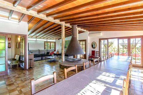 a living room with a large table and chairs at Catalunya Casas Nature and Tranquility for 24 pax - 30km to beach in Sant Pere de Vilamajor