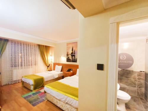 Postel nebo postele na pokoji v ubytování Ceylan Hotel
