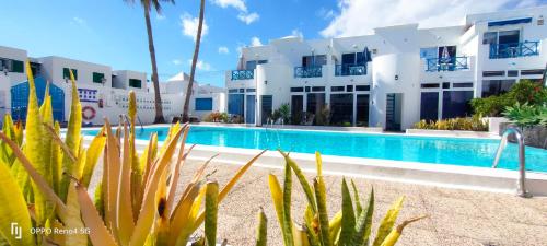 a view of a hotel with a swimming pool at RED in Puerto del Carmen