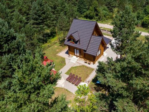 an overhead view of a house in the woods at Apartments Plitvice forest in Korenica