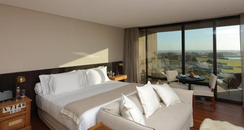Postel nebo postele na pokoji v ubytování Hotel Fasano Punta del Este