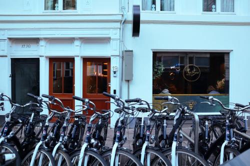 a bunch of bikes parked in front of a building at The Bee Hostel in Amsterdam