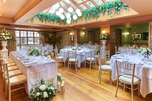 a banquet hall with white tables and chairs at Hotel Du Vin & Bistro York in York