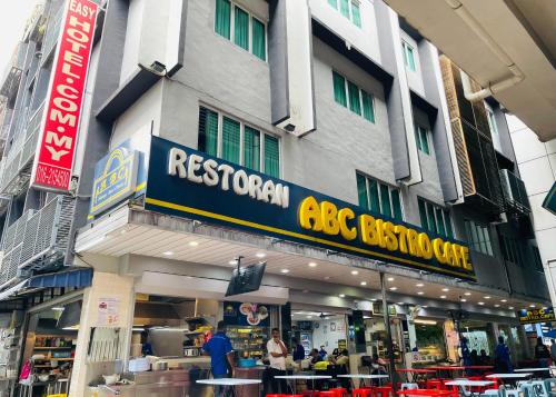 a building with a restaurant sign in front of it at City Central Hotel in Kuala Lumpur