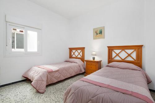 A bed or beds in a room at Casa Mela
