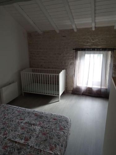 Postel nebo postele na pokoji v ubytování Logement moderne