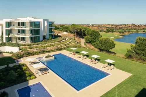an aerial view of a resort with a swimming pool at Monte Rei Golf & Country Club in Vila Nova de Cacela
