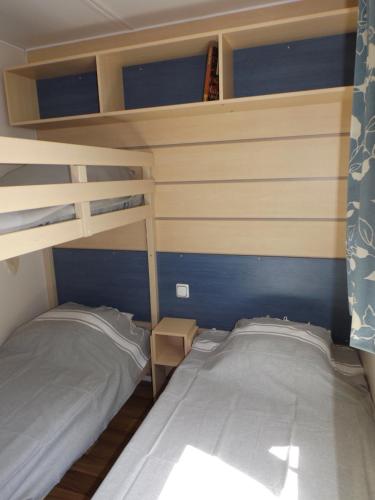 Posteľ alebo postele v izbe v ubytovaní Location mobil home