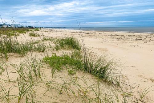 a sandy beach with some grass and the ocean at Seaside Searenity in Indian Pass
