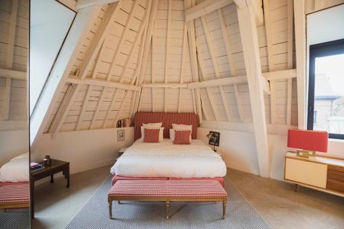 a bedroom with two beds in a room at Oever House in Antwerp