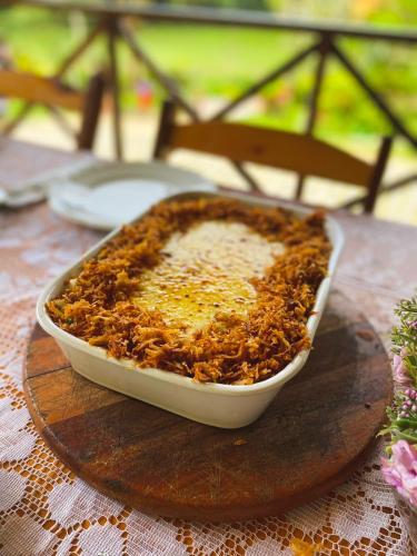 a dish of food sitting on a table at Pousada e Bistrô Estância Monte Horebe in Mulungu