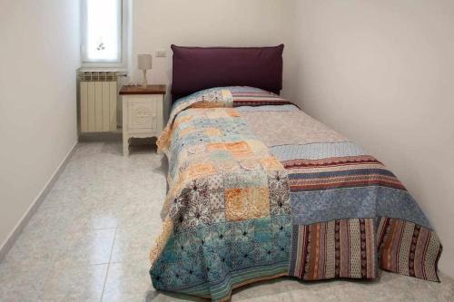 เตียงในห้องที่ Sanremo Dream - Geco Blu