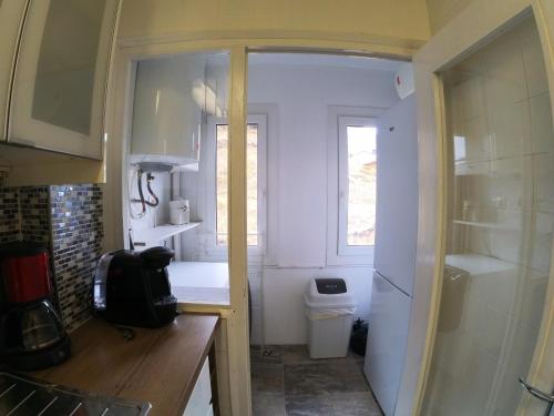 a small kitchen with a sink and a toilet at Soldeu Paradis Soldeu in Soldeu