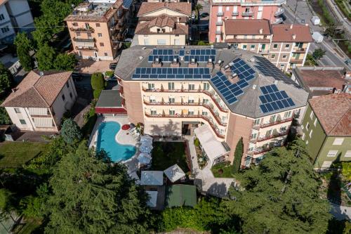 an aerial view of a house with solar panels on it at Hotel Imperial ***S in Garda