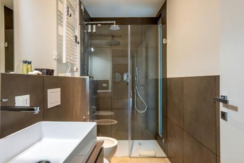 a bathroom with a shower and a sink at LUVI - De Rolandi - Il Cortile Milano in Milan